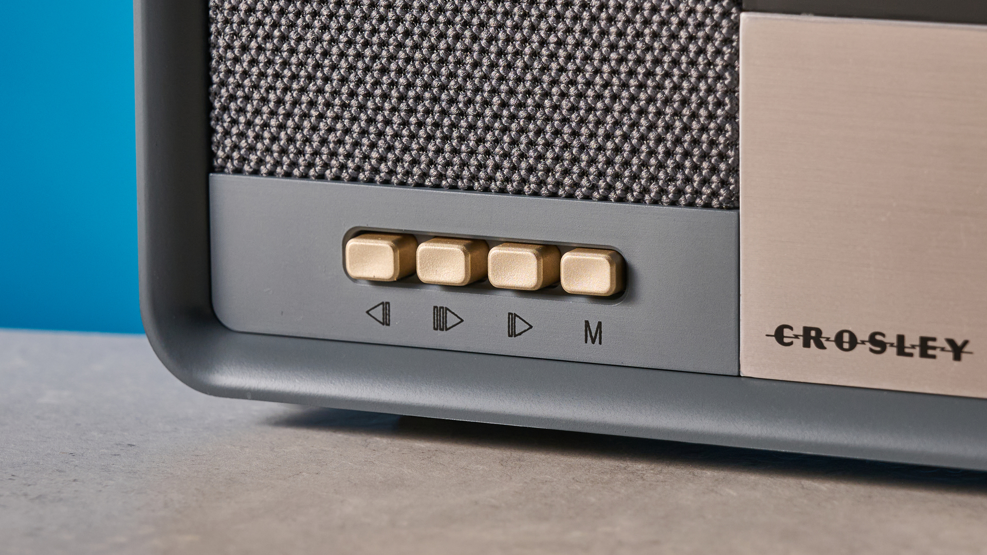 Crosley Tribute Radio in gray color photographed on a blue background