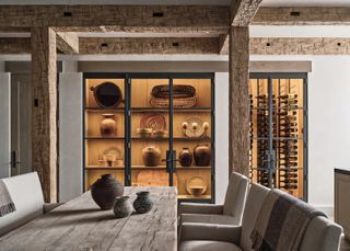 A dining room with warm cabinet lighting