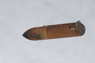 A camera in the umbilical well of space shuttle Endeavor captured this image of the STS-134 external fuel tank after it had been jettisoned, and was falling back to Earth. Launch took place on May 16, 2011.