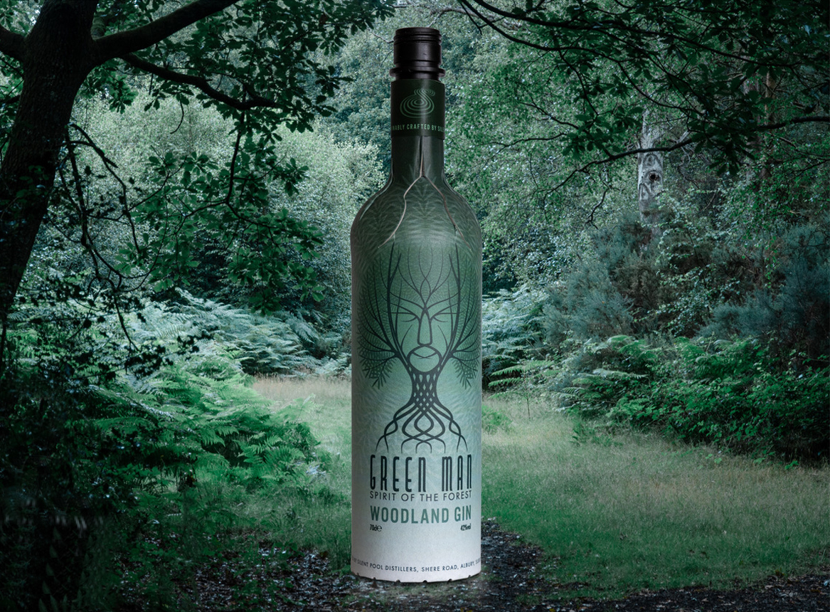A bottle of gin superimposed on a woodland scene