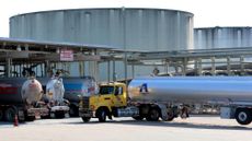 Oil tanker trucks are seen at a fueling station in Holbrook, New York.