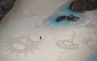 Artist Andres Amador created this beautiful design on Plemont beach, Jersey. Image Carl Court