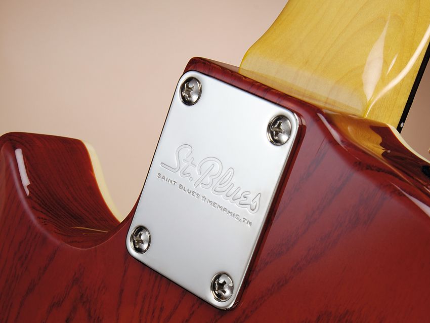 The neck is fixed standard-style with four machine screws and rectangular plate