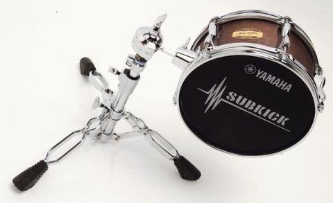 The stand enables vertical positioning in front of the bass drum.