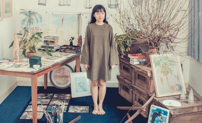 Thao-Nguyen Phan at her Ho Chi Minh City studio with some of her sketches and objects that inspire her