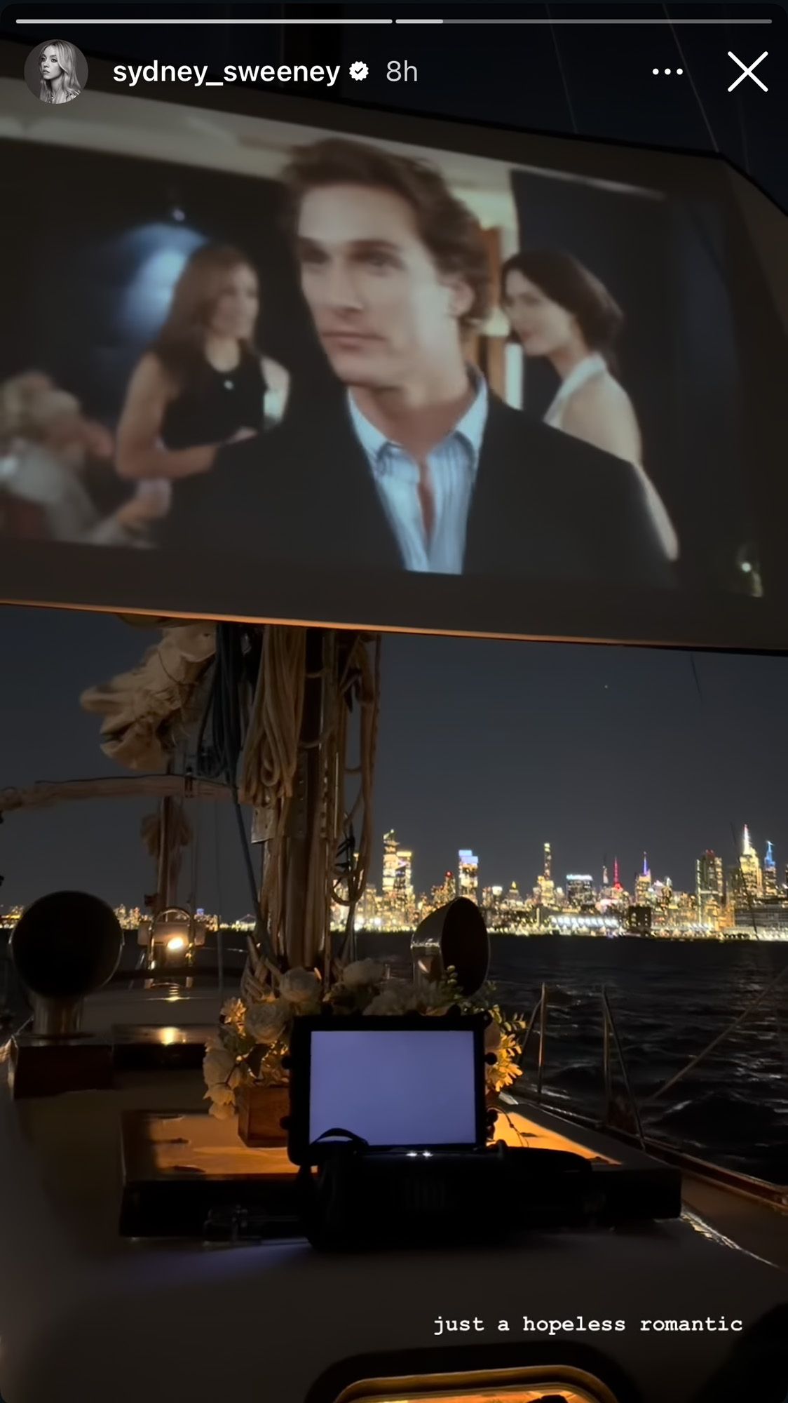 New York skyline and date night with Matthew McConaughey movie on the video screen.