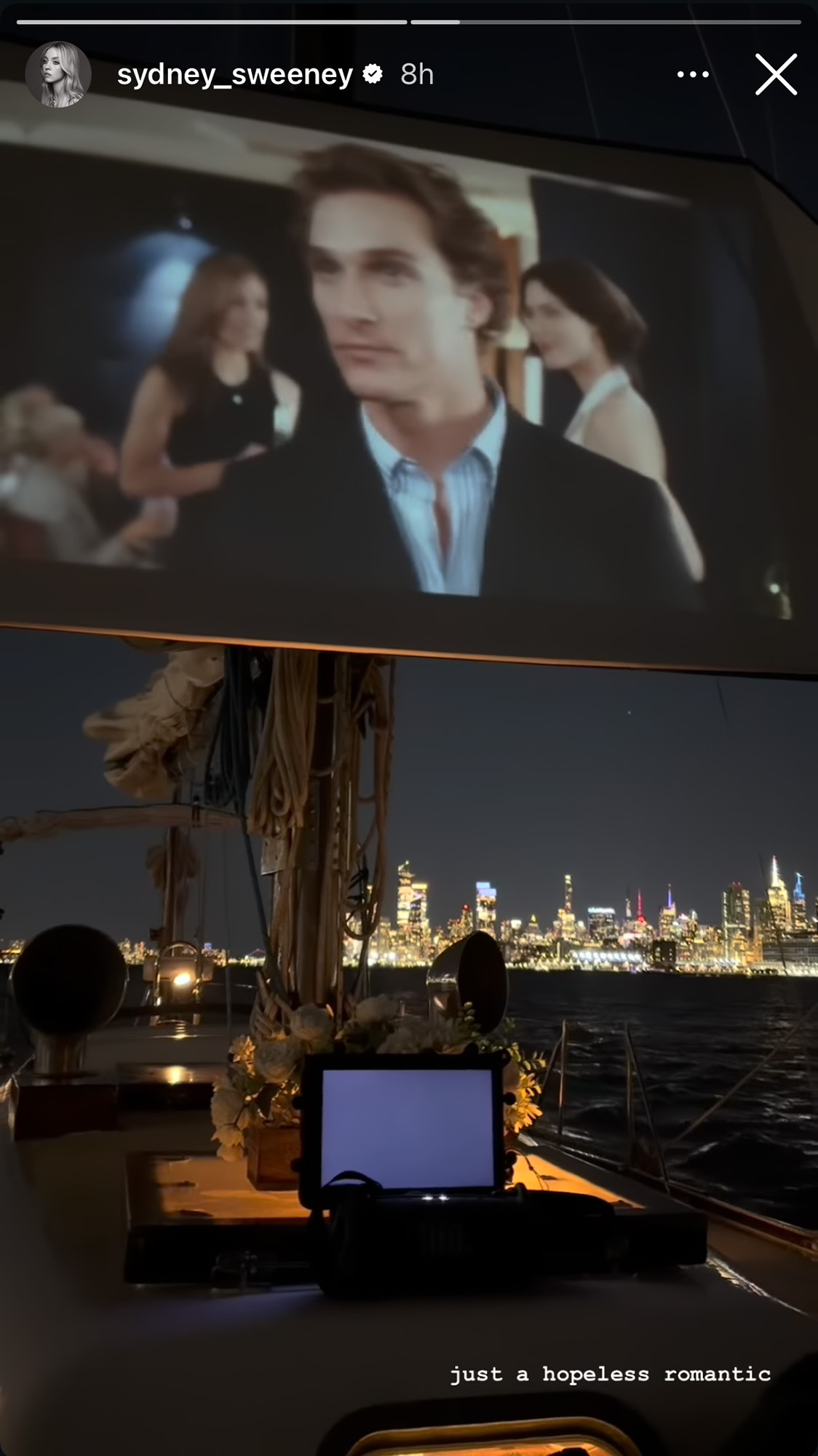 New York skyline and date night with Matthew McConaughey movie on the video screen.