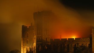 Flames lick the roof of the Queen's private and state apartments in Windsor Castle