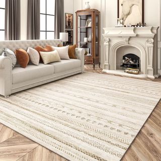 A white textured area rug in a neutral-colored living room