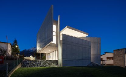 Abstract grey stone building at night