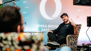 An Opera employee being interviewed on a comfortable chair