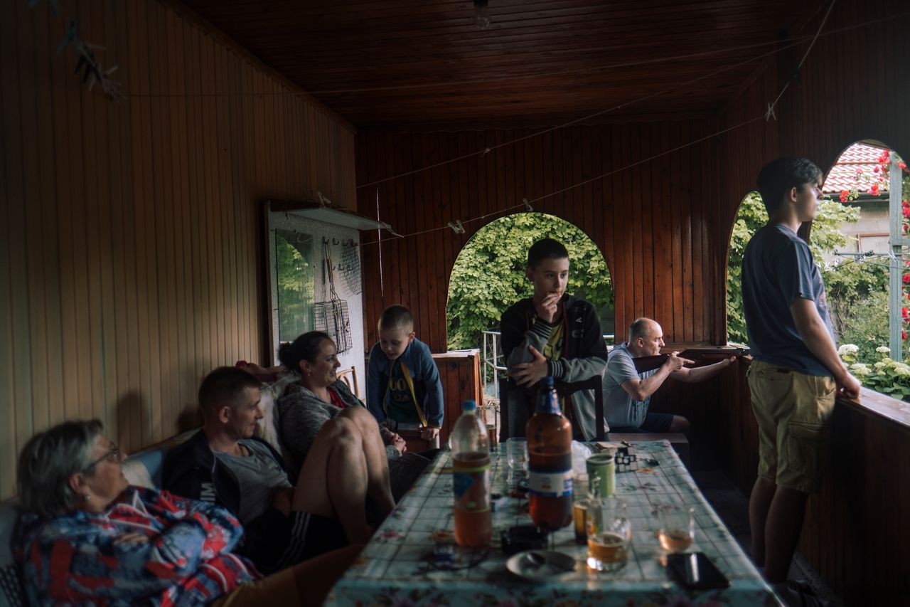 Family shooting with an air rifle. Tiraspol, Transnistria, Republic of Moldova 2024. From the series &ldquo;Bright Memory&rdquo;