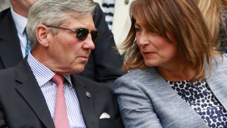 Michael and Carole Middleton are in conversation as they watch on from the stands in centre court as Julien Benneteau of France is in action during the Men's Singles second round match against Kei Nishikori of Japan on day four of the Wimbledon Lawn Tennis Championships at the All England Lawn Tennis and Croquet Club on June 30, 2016 in London, England
