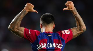 Joao Cancelo celebrates after scoring a late winner for Barcelona against Celta Vigo in September 2023.