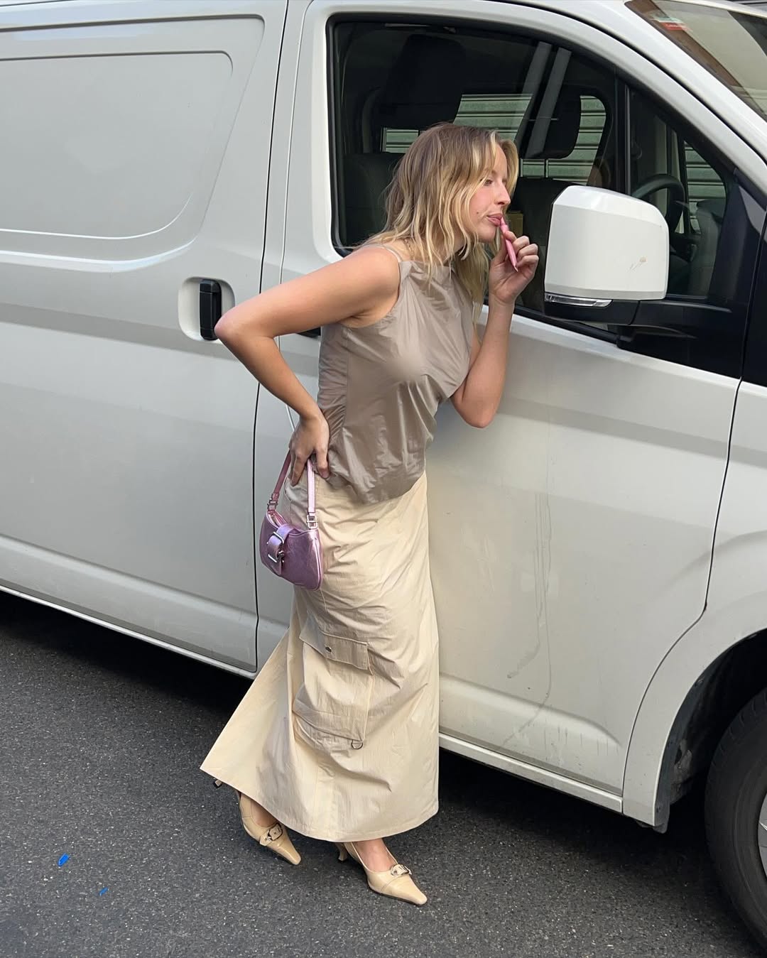 Woman wearing camel colored clothing summer 2025