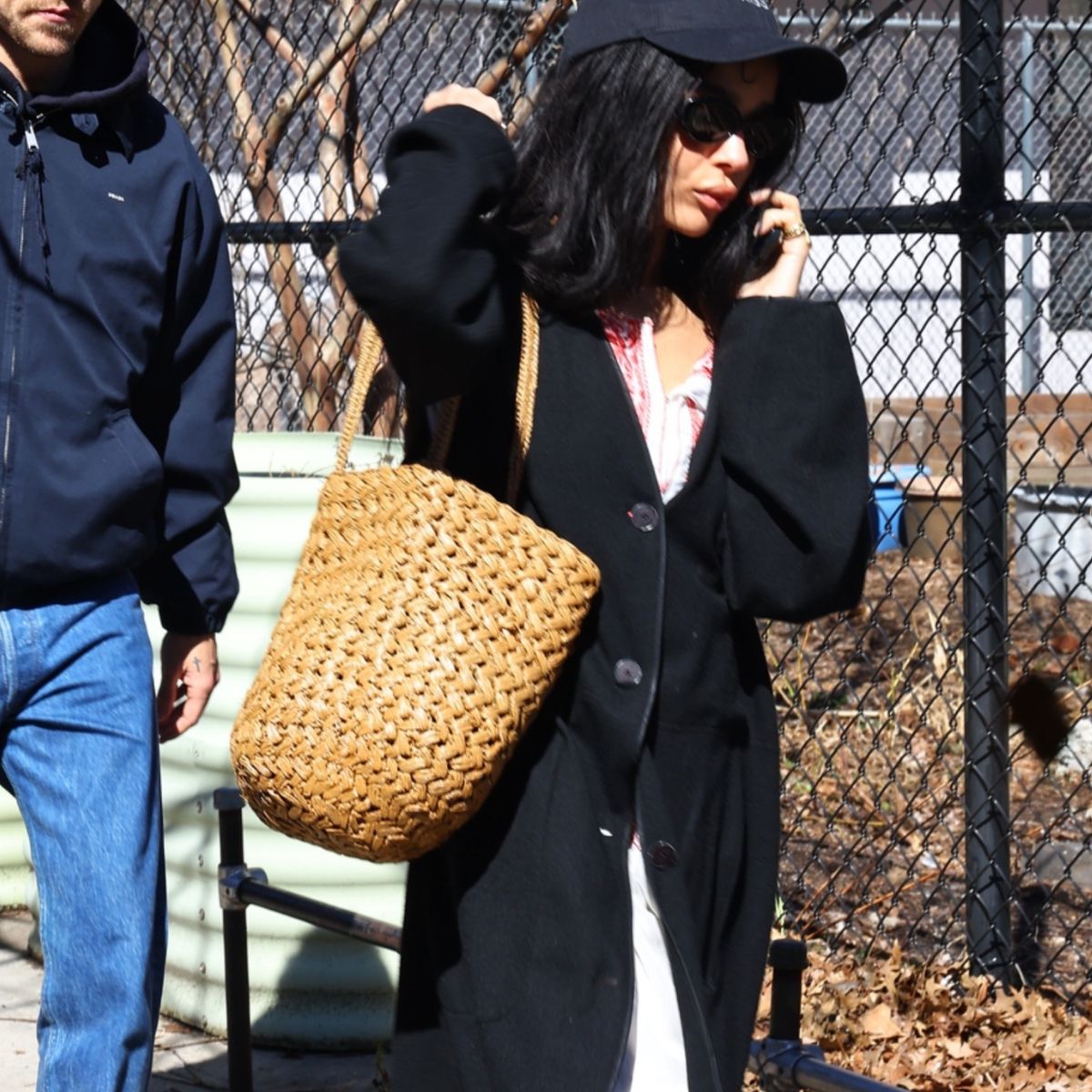Zoe Kravitz holding The Row's basket bag.
