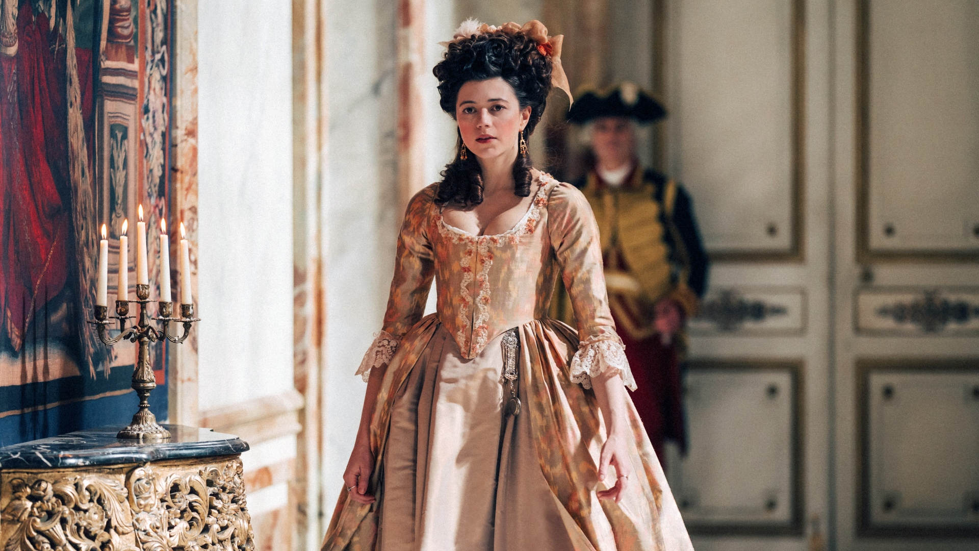 Lamballe stands in a hallway in Marie Antoinette