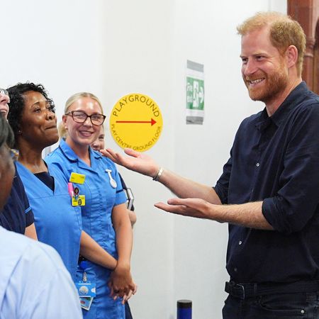 Prince Harry visits Birmingham Children's Hospital where he meets a young patient who loved Lego, just like his son Archie