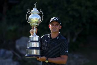 Christiaan Bezuidenhout holds the South African Open trophy