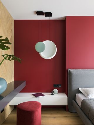 A bedroom in deep red paint