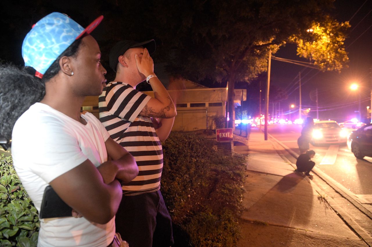 Jermaine Towns and Brandon Shuford wait down the street from a shooting at Pulse Nightclub in Orlando