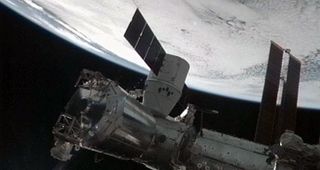 SpaceX's Dragon space capsule is seen docked to the Harmony module on the International Space Station after its successful capture via robotic arm on Oct. 10, 2012.