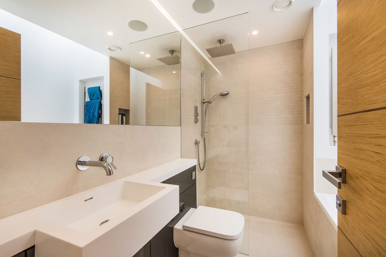 shower room with beige tiles in self build