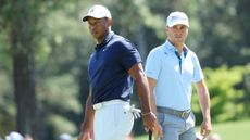 Justin Thomas and Tiger Woods pictured