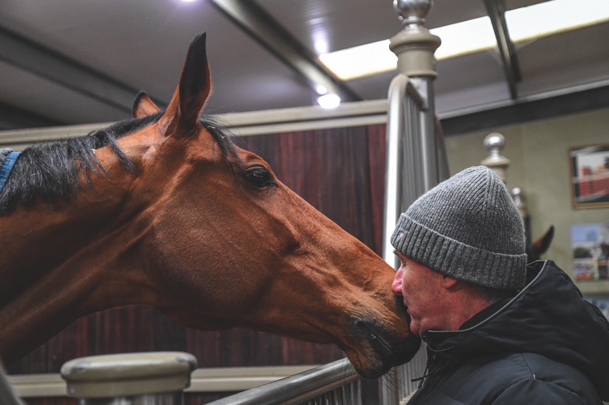 Peter Charles gives Stardust a kiss at home