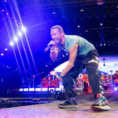 Chris Martin of Coldplay performs as the band headline the Pyramid stage during day four of Glastonbury Festival 2024 at Worthy Farm, Pilton on June 29, 2024 in Glastonbury, England.