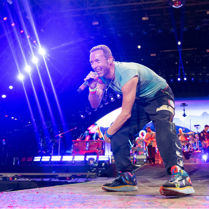 Chris Martin of Coldplay performs as the band headline the Pyramid stage during day four of Glastonbury Festival 2024 at Worthy Farm, Pilton on June 29, 2024 in Glastonbury, England.