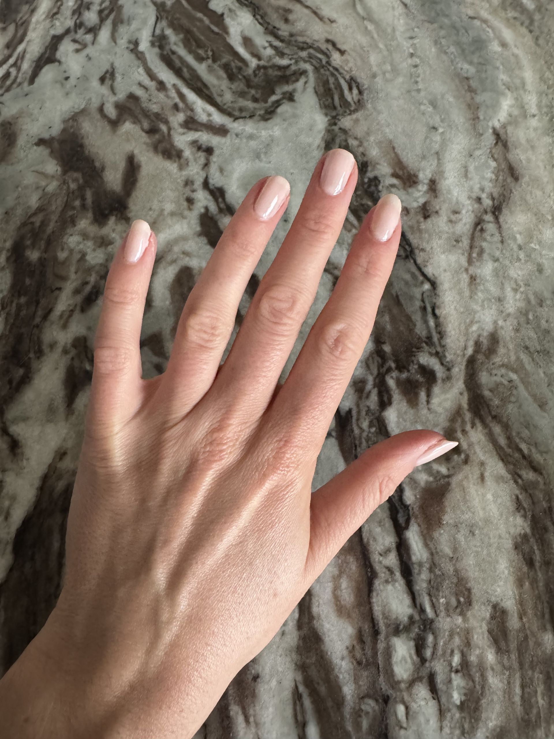 Eleanor wearing Essie Gel Couture nail polish in Fairy Tailor, a milky pink colour
