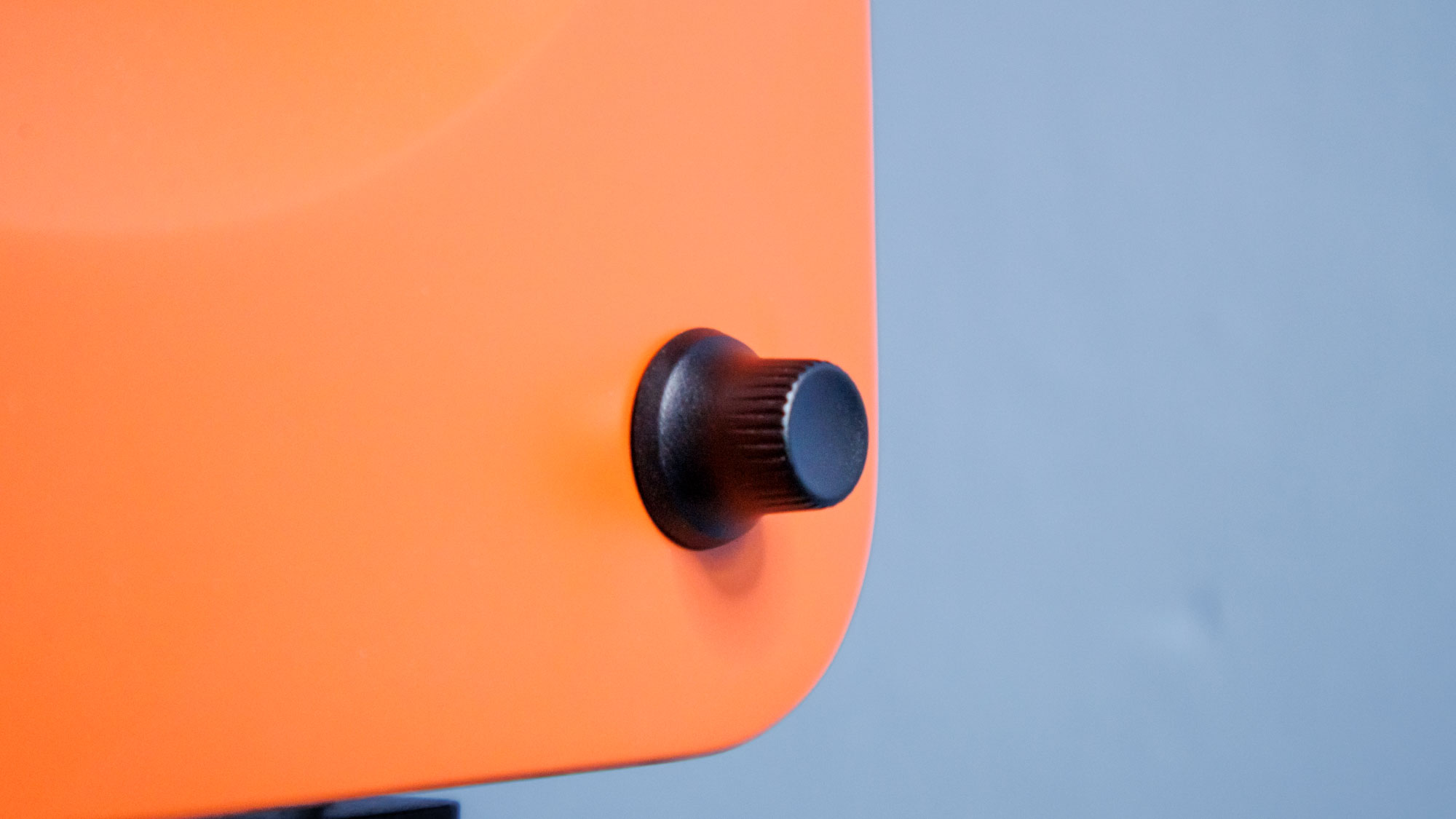 orange Kanto Ren closeup of the black volume control