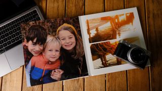 A stack of various photo books on a desk