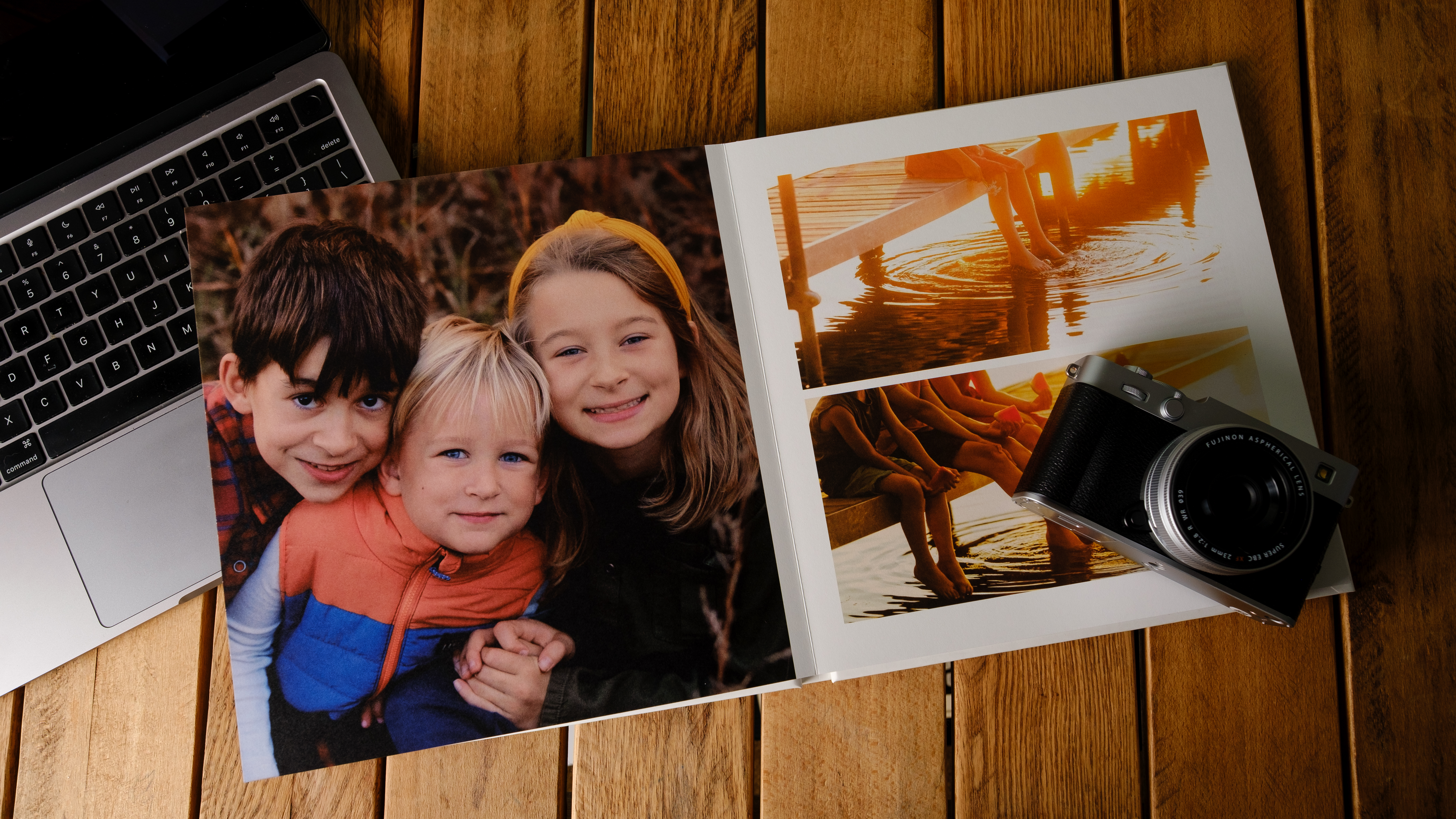 A stack of various photo books on a desk