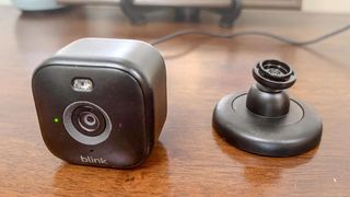 Blink Mini 2 removed from its base on table