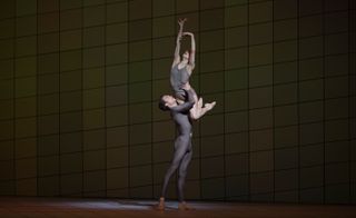 Male ballet dancer lifting the female ballet dancer