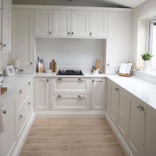 Cream shaker kitchen with horizontal flooring