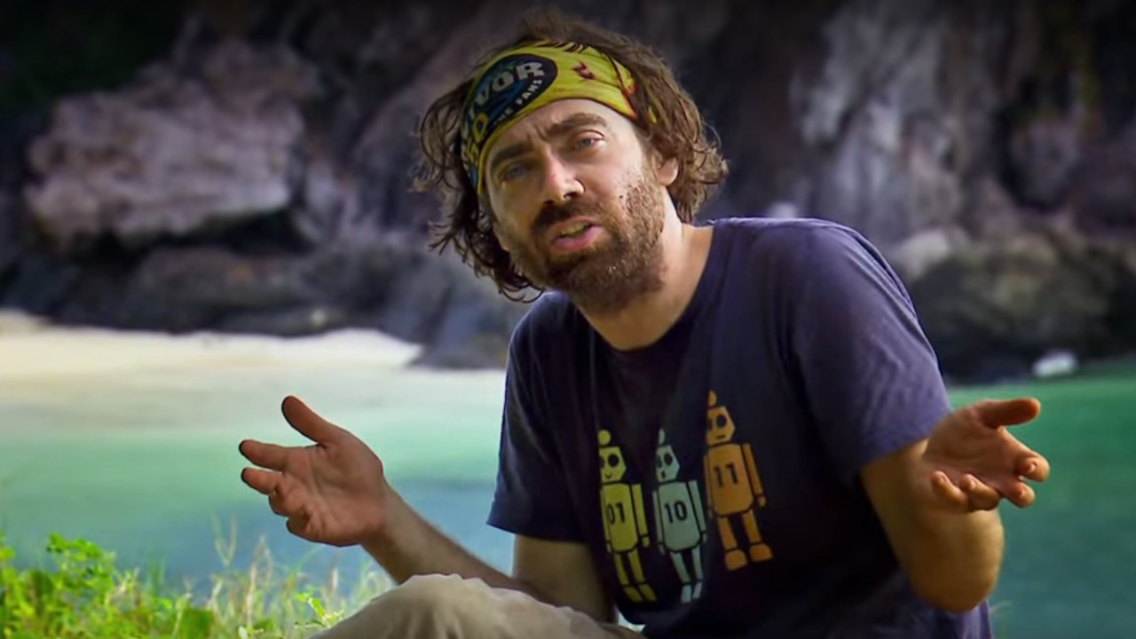 Christian shrugs his shoulders while talking about an advantage on Survivor 50.