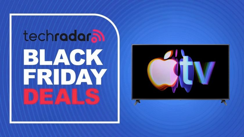 A Black Friday deals sign next to a TV with the Apple TV logo on it