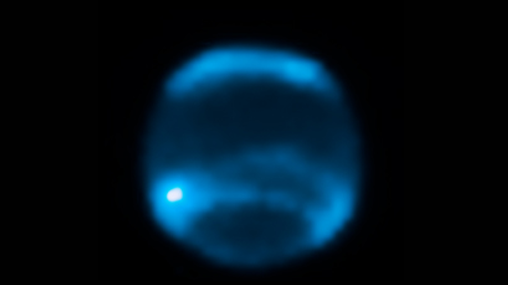 Blurry image of neptune, striped in thick bands of blue and dark blue.