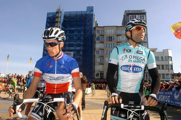 Omega Pharma-QuickStep's Sylvain Chavanel, left, and Francesco Chicchi await the start of stage 1.