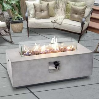 Teamson Home Gas Fire Pit with Cover on patio area