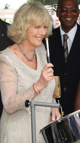 Queen Camilla playing steel drums on her tour of the Caribbean in 2008