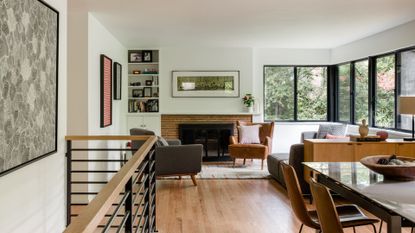 The living room are of a treehouse-like home surrounded by Olmstead-designed park 