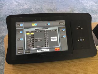 A close up of a Extron tablet.