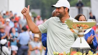 Scottie Scheffler with the FedEx Cup