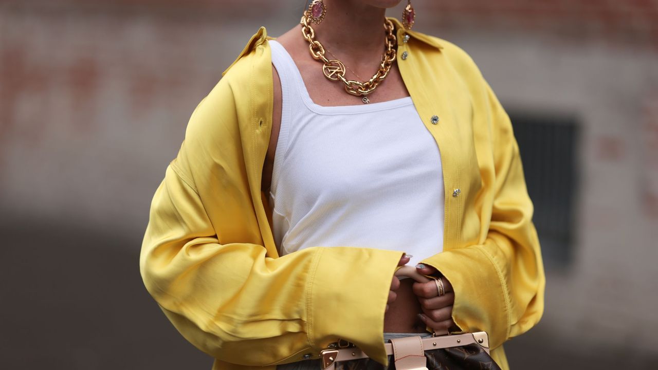 Woman in yellow silk shirt GettyImages-1605016009