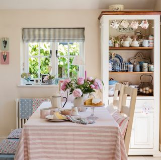 kitchen with pink tablecloth in extended 17th century cottage
