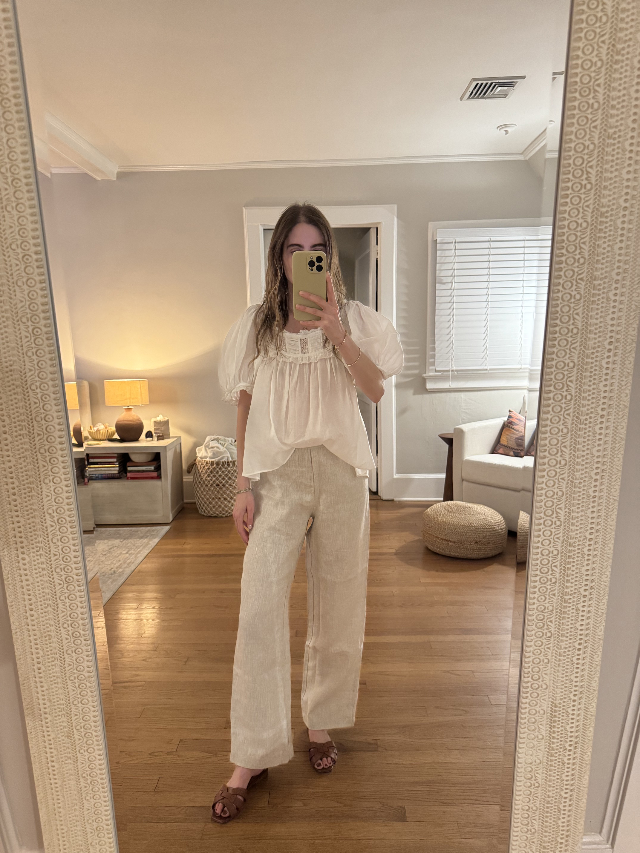 Tessa Faye O'Connell wearing tan linen pants